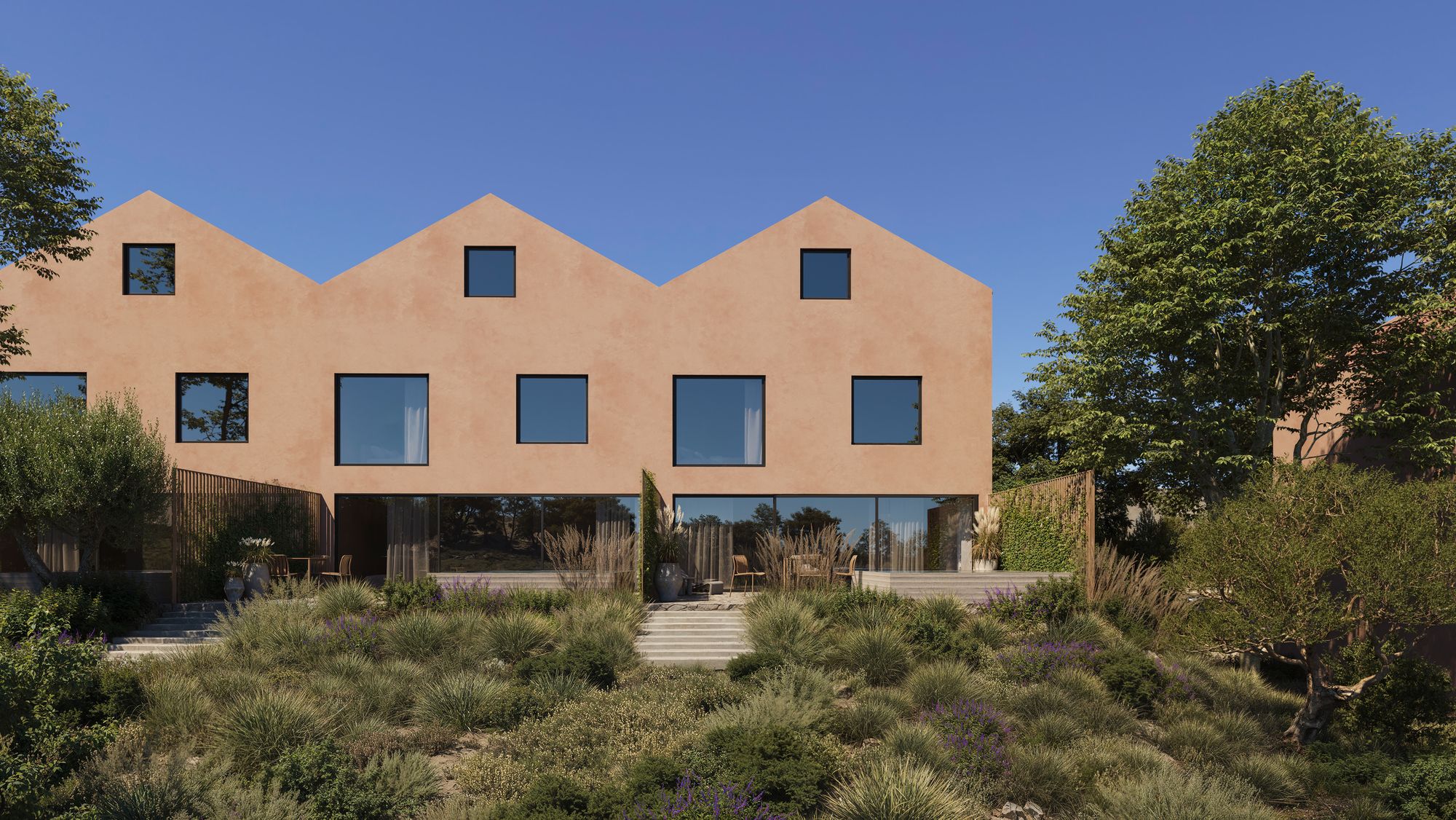 Casa Miradouro from the garden: large square first-floor windows above a glass ground floor and a stepped terrace